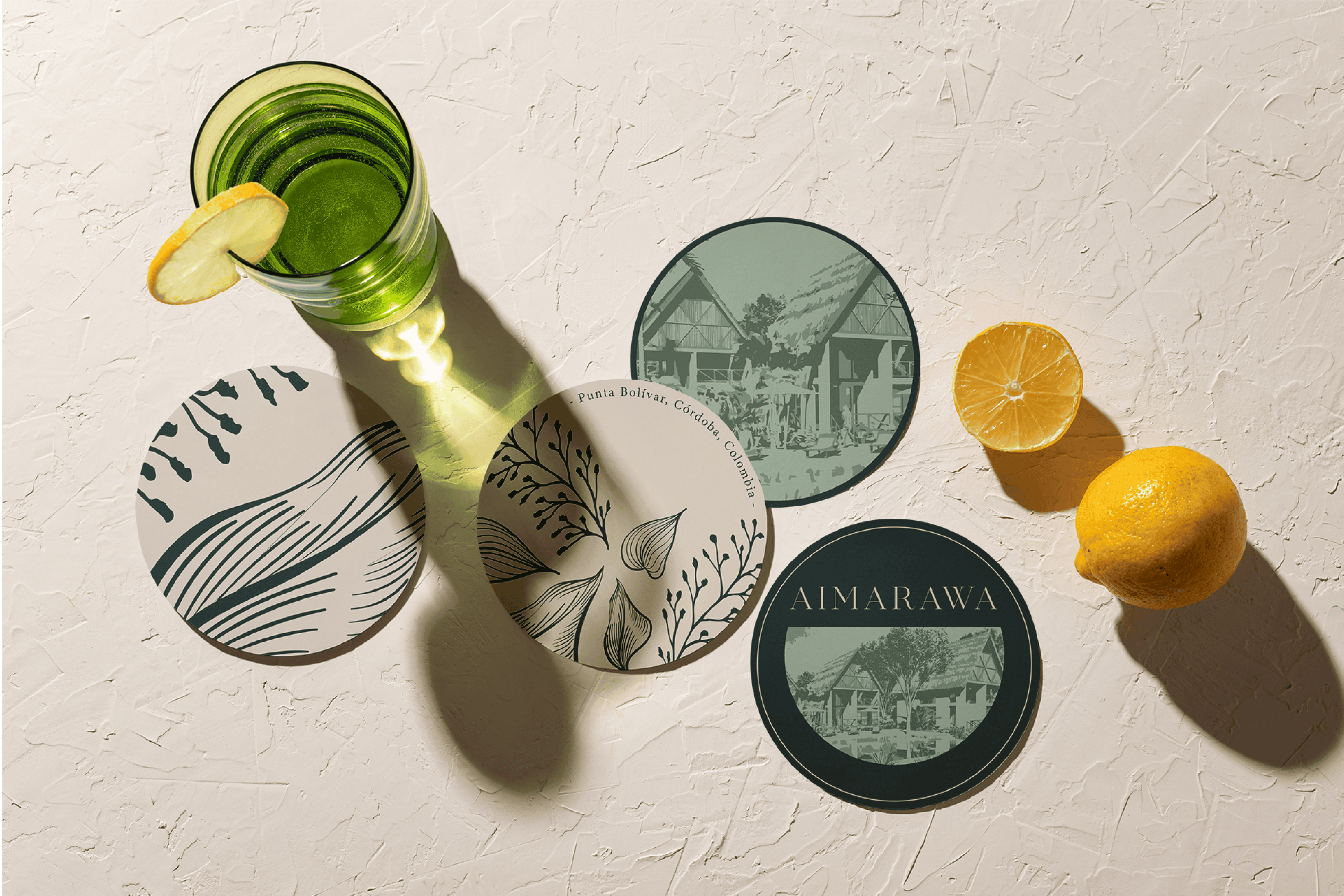 Vibrant green beverage in a glass with lemon slice, accompanied by decorative coasters featuring nat.