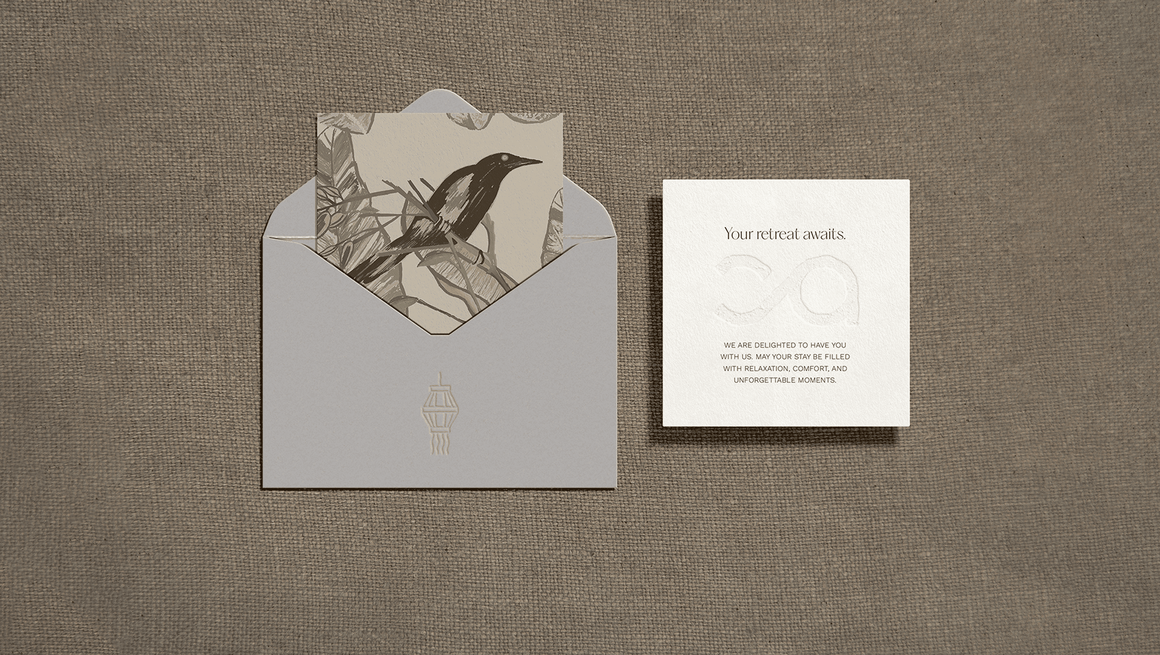 Elegant bird illustration with retreat invitation card and envelope on textured background.