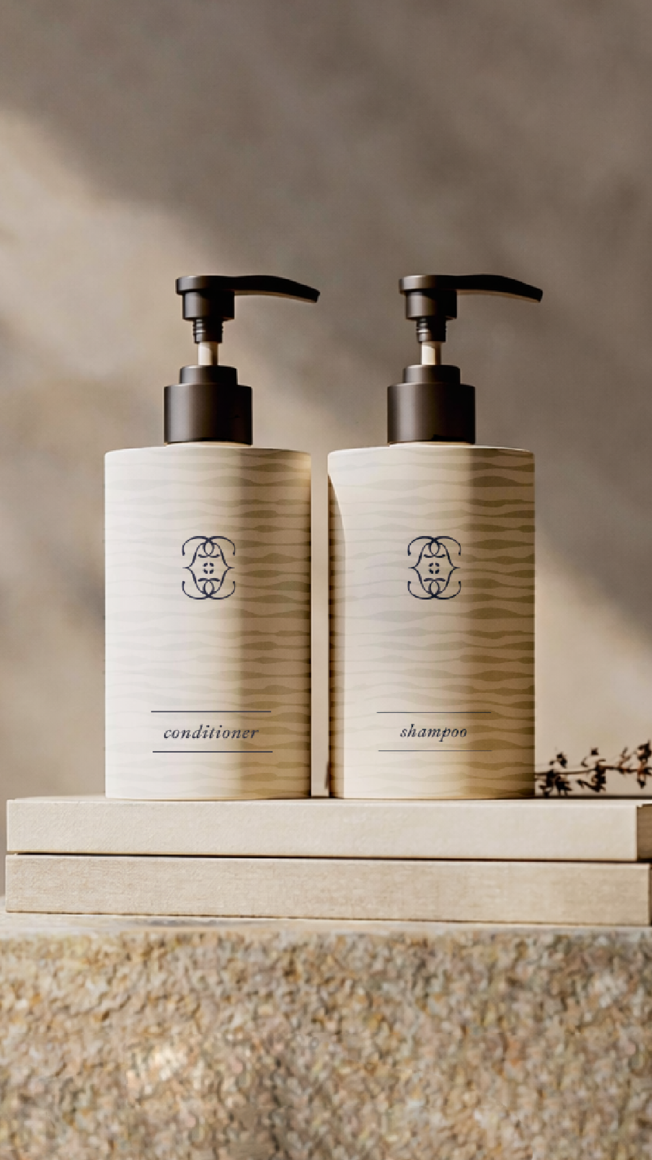 Stylish shampoo and conditioner bottles with pump dispensers for modern bathroom decor.