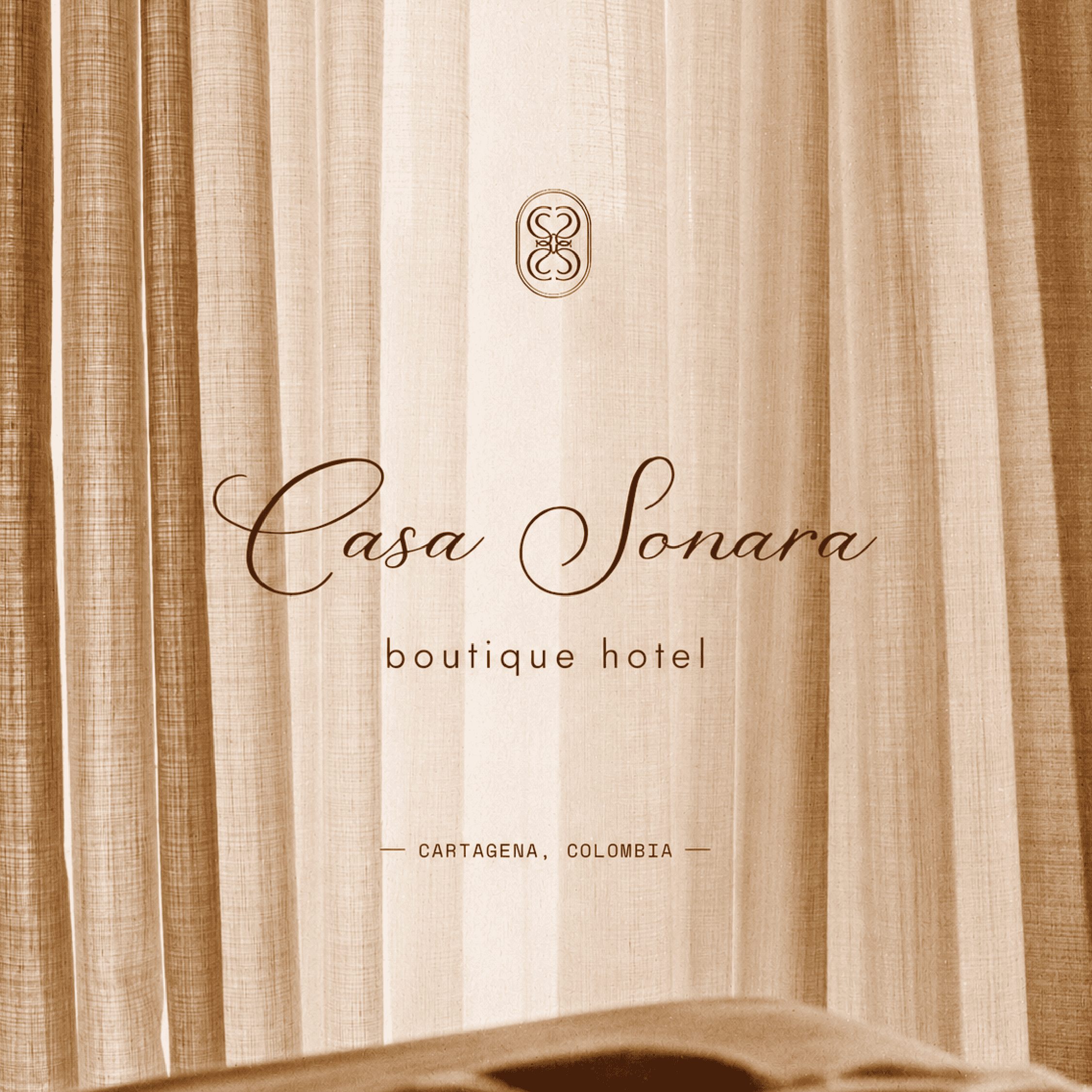 Elegant boutique hotel entrance with curtains, showcasing luxury and comfort at Casa Sonara in Carta.