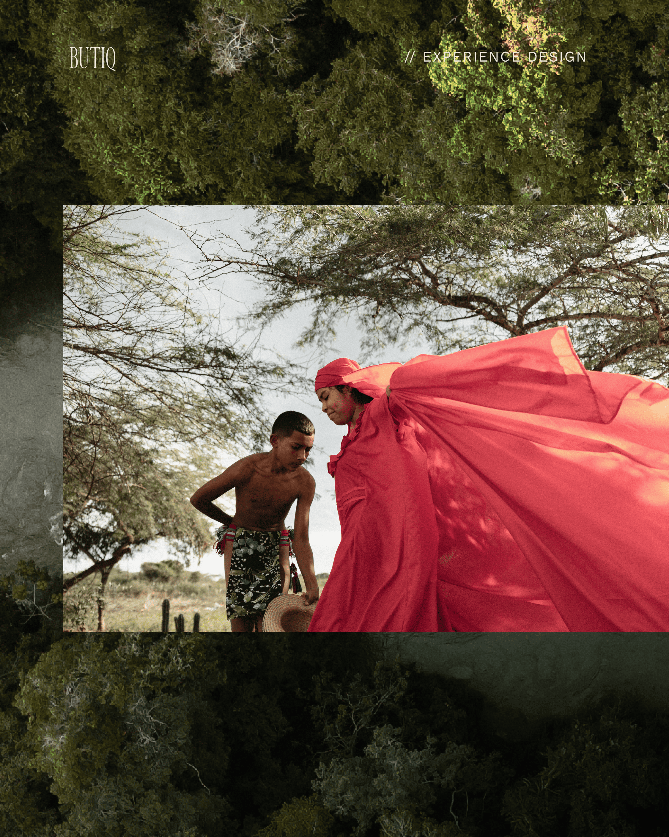 Beautiful African woman in vibrant red dress with a young boy outdoors.