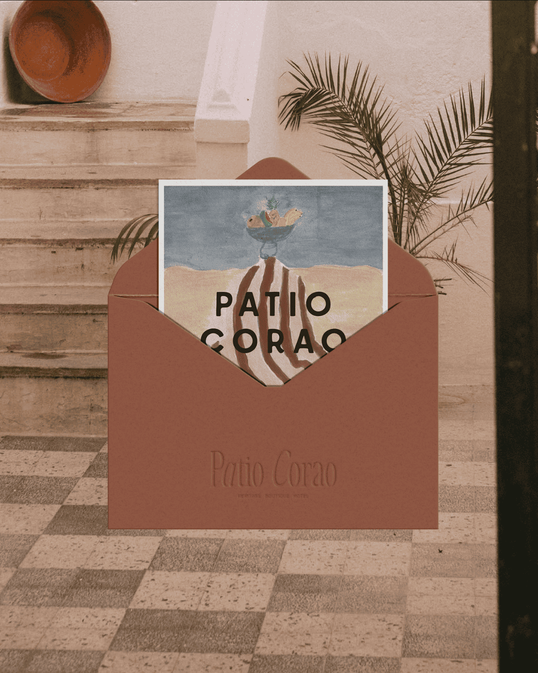 Patio Corao promotional card in envelope with tropical design and palm leaves.