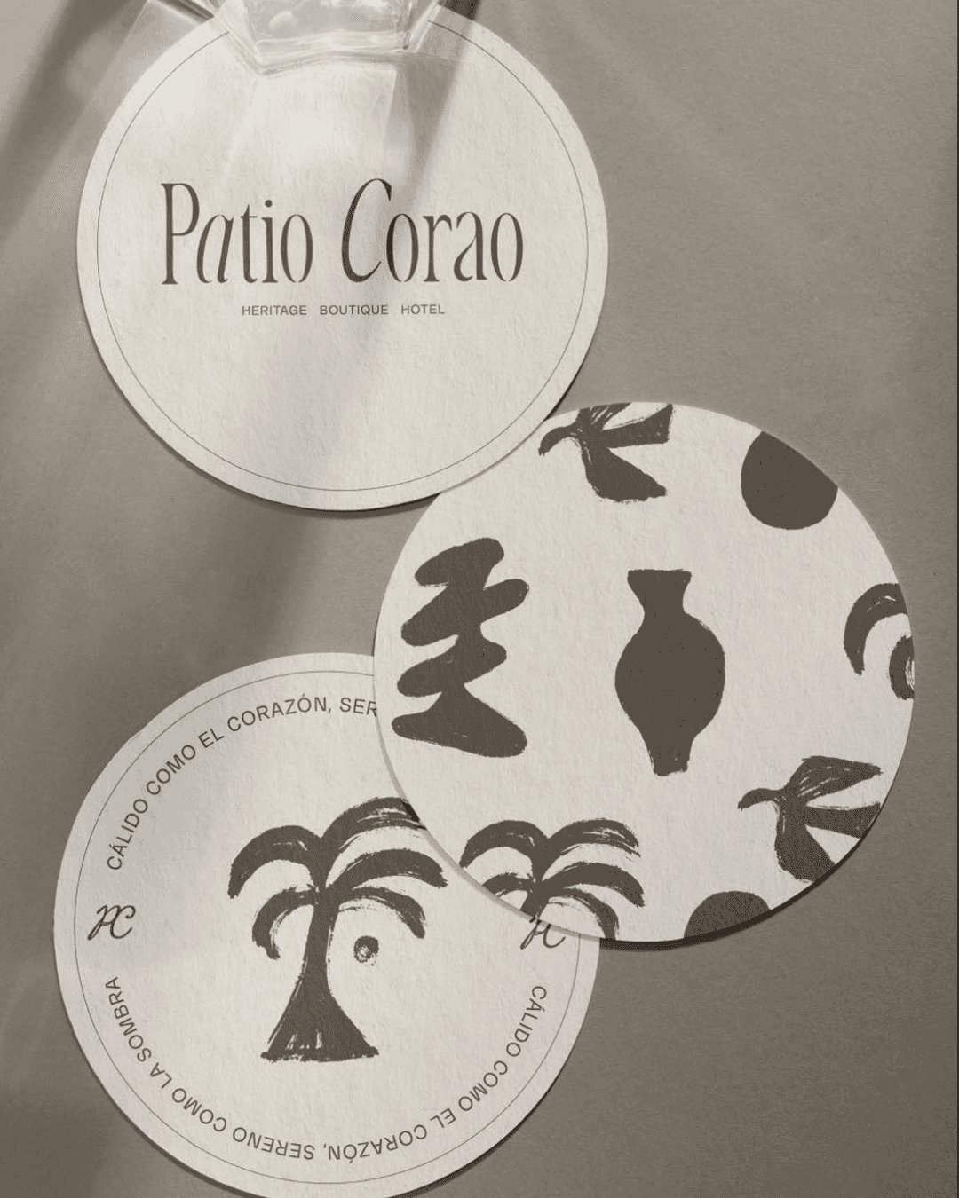 Heritage Boutique Hotel sign with tropical palm and abstract patterns, promoting luxury and cultural.