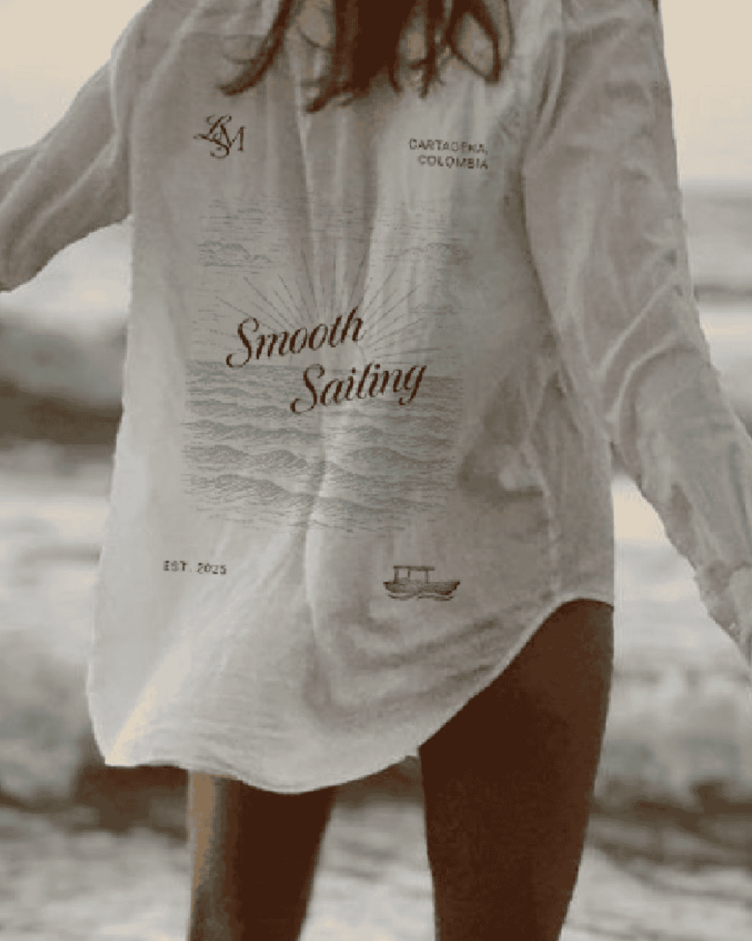 Casual white T-shirt with ocean-inspired design, perfect for beachwear and summer outings.