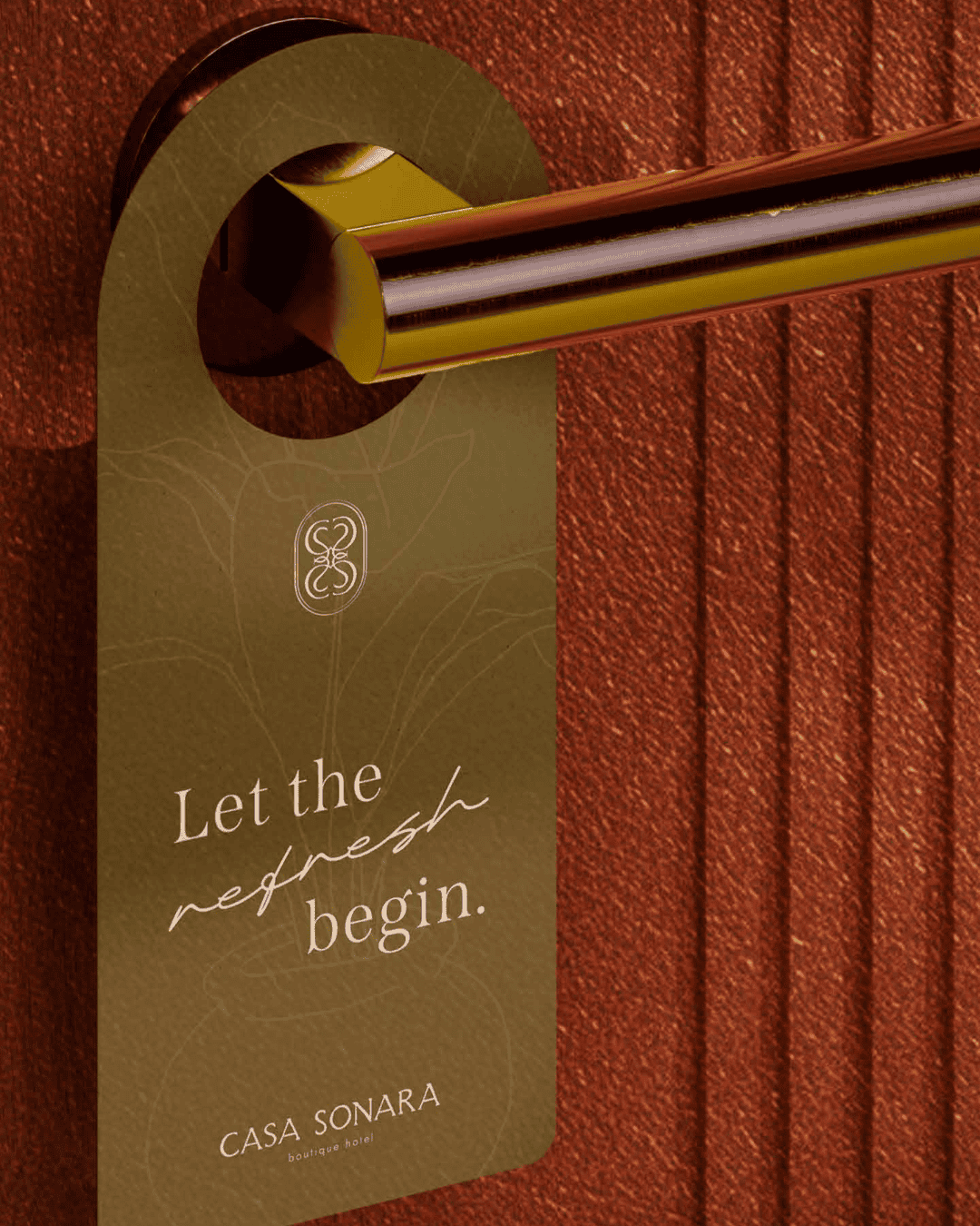 Door handle with Casa Sonara tag, eco-friendly design, warm brown tones.