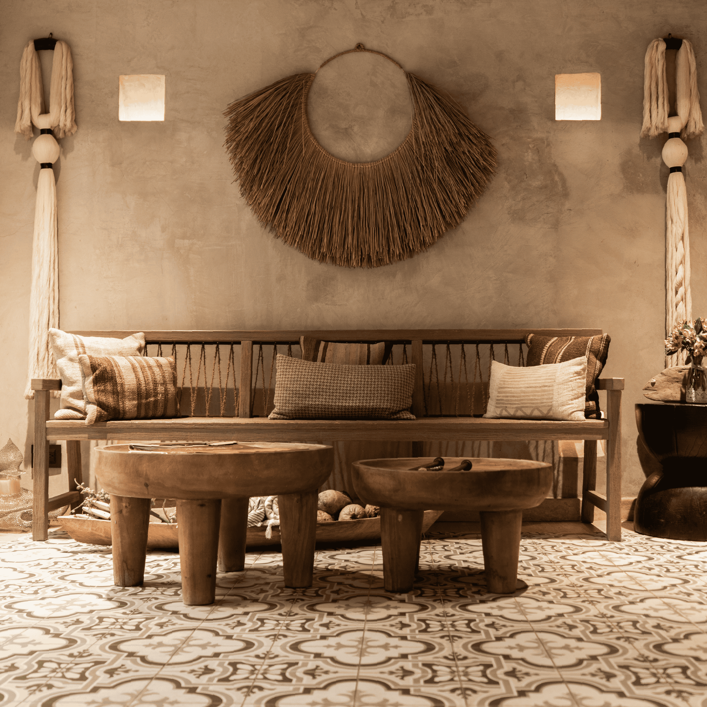 Boho living room with earthy tones, wooden furniture, and woven wall art, creating a cozy and stylis.