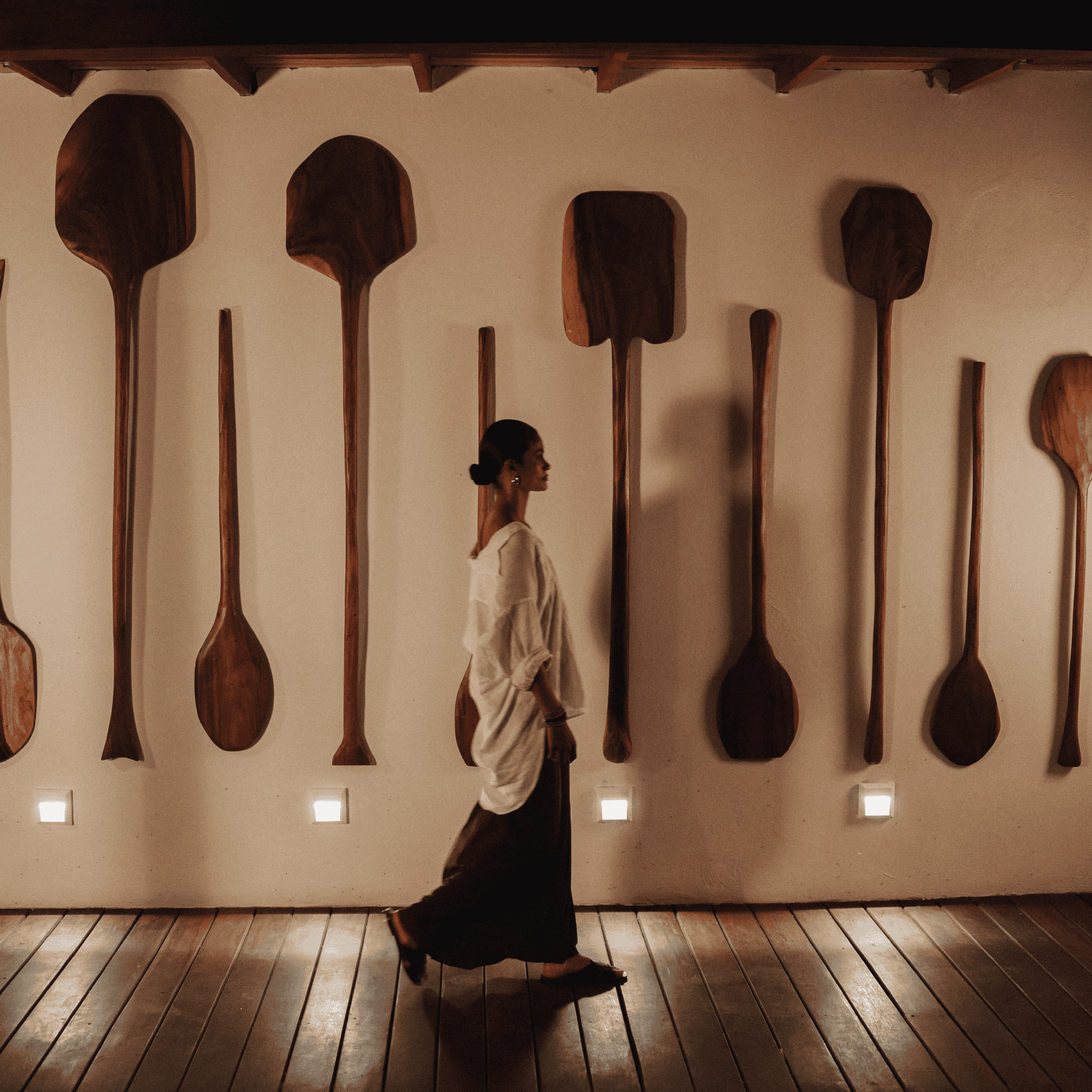 Wooden spoons wall decor at Butiq World store, artisanal kitchen accessories.