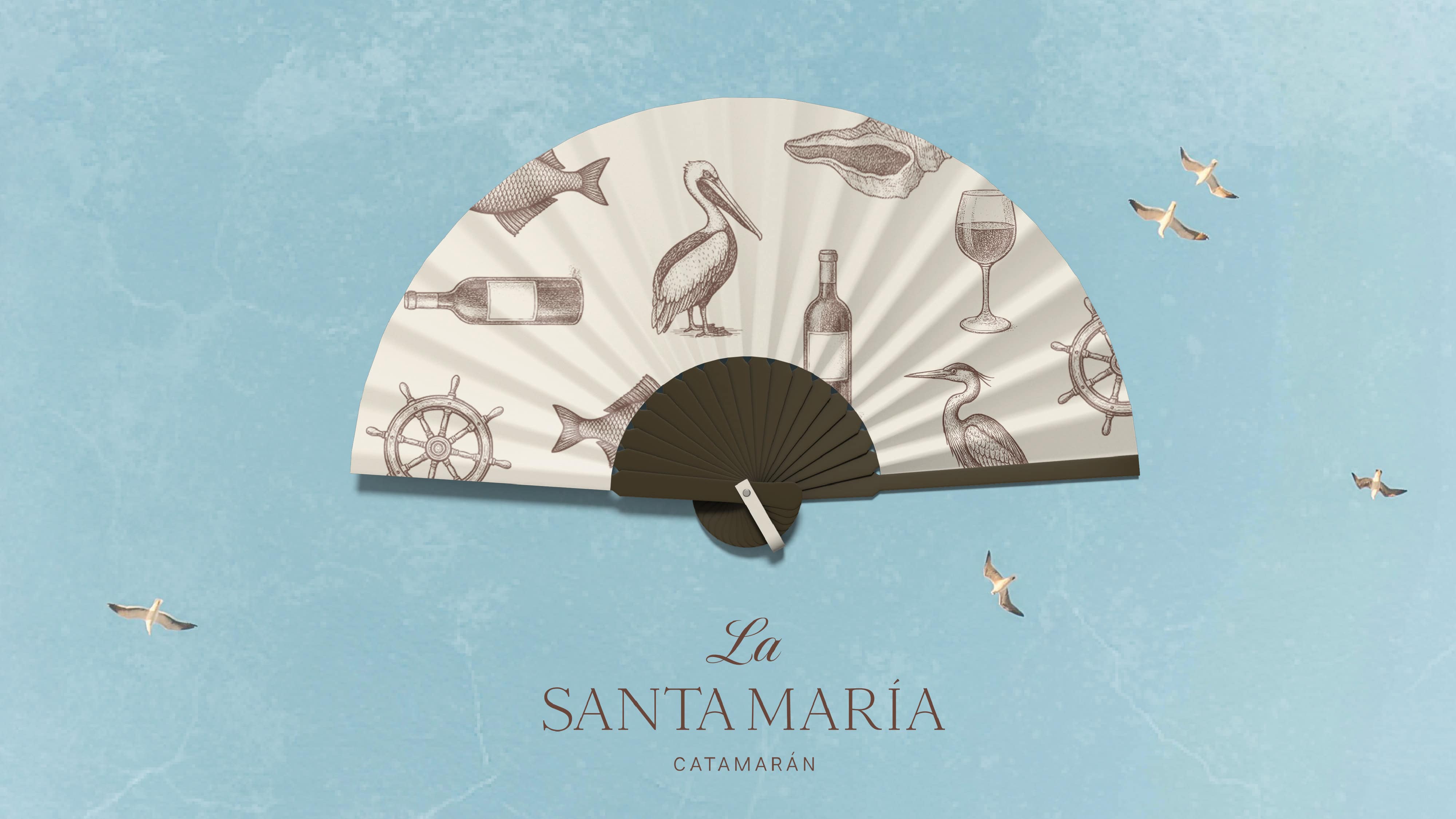 Decorative hand fan with nautical and maritime symbols for La Santa María event.
